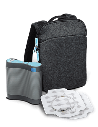 Image of the Optune Lua new device bag, portable electrical field generator and transducer arrays